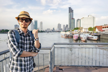 Obraz premium Asian man bag pack tourist in travelling at Thailand.