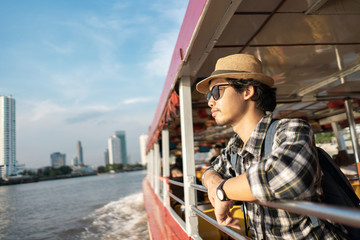 Asian man bag pack tourist in travelling at Thailand.