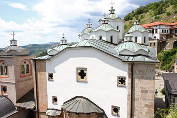 Fototapeta na wymiar Panorama to church of Virgin Mary and medieval building in Monastery Saint Joachim of Osogovo, Kriva Palanka, Republic of Macedonia. The domes of a church. Christianity. 
