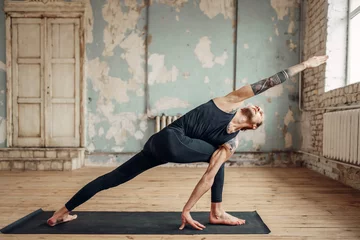 Tuinposter Male yoga doing flexibility exercise © Nomad_Soul