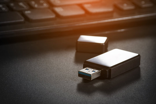 USB flash drive on Case computer. place on Office desk / Card Reader / selective focus