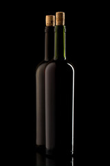 Wine bottles with cork and on black isolated background