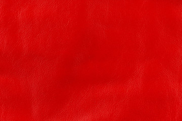 Texture background from red leather of medium grain