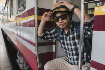 Asian man bag pack tourist in railway station at Thailand.