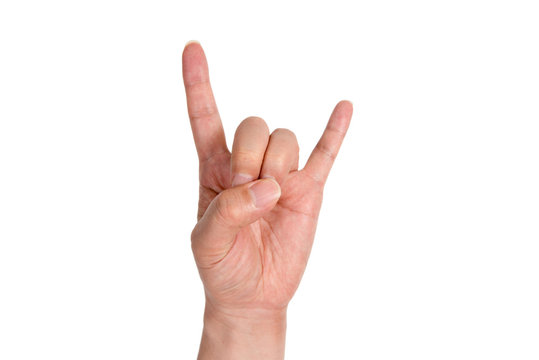 A man's hand giving the Rock and Roll sign.