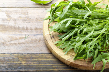 fresh arugula on a wooden background