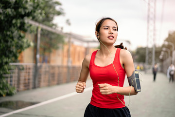 woman running in run lane in city.