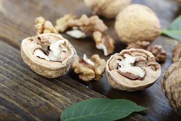 walnuts chopped on a wooden background