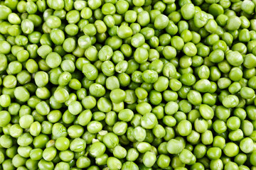 Green peas scattered background,  texture vegetables.