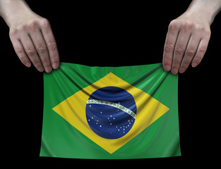 Man holding Soccer ball with Brazilian flag