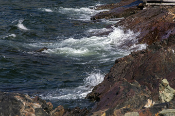 rocky Newfoundland coastline on Fogo Island, crashing waves
