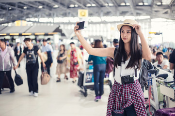 Young woman selfie in international airport,
