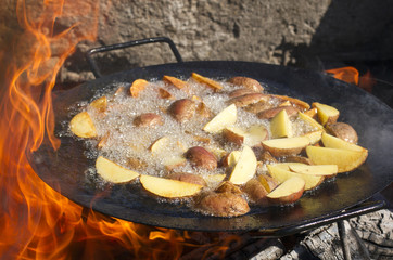 Fried potatoes in a frying pan