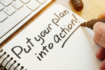 Put your plan into action written by hand. Business motivation.