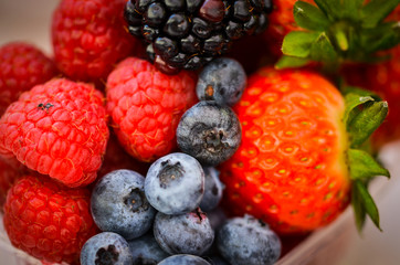 fresh fruits close up view - strawberry, blueberry, red berry, raspberry, blackberry