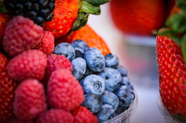 fresh fruits close up view - strawberry, blueberry, red berry, raspberry, blackberry