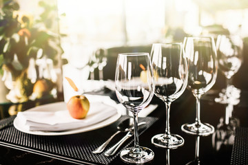 fancy table setting with wine glasses at a elegant restaurant
