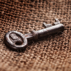 old keys on a brown canvas background