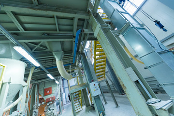 Fiberglass production industry equipment at manufacture background