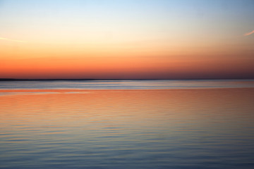 Fototapeta na wymiar Sunset skyline from the shore of Kiev sea