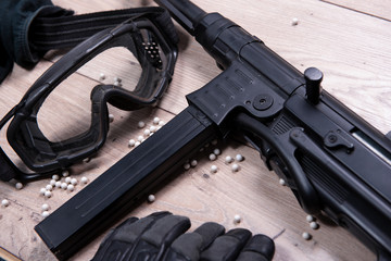 airsoft gun with protective glasses and lot of bullets