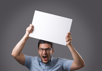 Youn man holds board