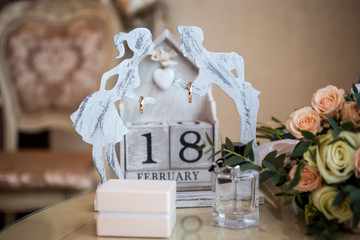 wedding rings hang on a beautiful stand