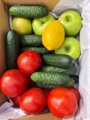 Seasonal fruits and vegetables in a box