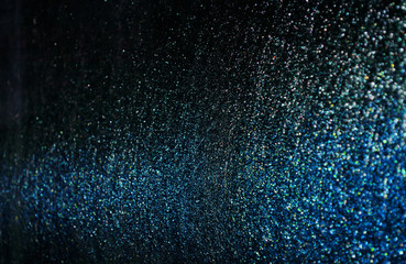 Naklejka na ściany i meble blue sparkling and shining star points on a black isolated background and a blue bright flash will create a festive mood