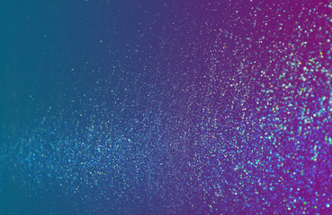 blue sparkling and shining star points on a gradient blue violet background and a blue bright flash...