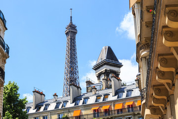 Fototapeta na wymiar Paris rooftops against a backdrop of Eiffel Tower