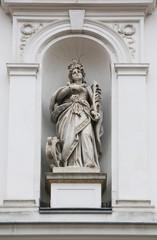 Fototapeta na wymiar Saint Catherine of Alexandria statue on the facade of St. Catherine church in Zagreb, Croatia 