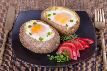 Baked potatoes stuffed with cheese and egg