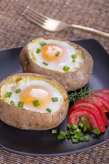 Baked potatoes stuffed with cheese and egg