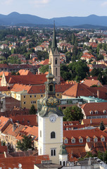 The towers of the church of St. Mary and St. Francis of Assisi with roofs in the background in...