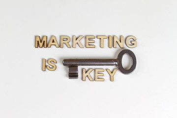 Marketing is key made with wooden letters and old key