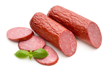 Salami smoked sausage, basil leaves on white background cutout.