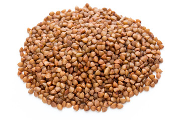 Buckwheat grains isolated on the white background.