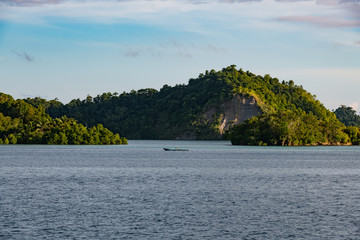 East Misool, group of small island with fishermen in shallow blue lagoon water, Raja Ampat, West Papua, Indonesia