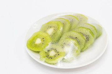 fruits which are wrapped with plastic film preservation on a table on white background.