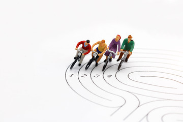 miniature people: Cyclist on the race against competitors.