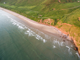 Aerial view of sunset at Rhossili Bay - Rhossili Bay has been voted Wales' Best Beach many times. It is located on the west coast of Gower Peninsular