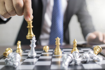 success, management and business leadership concept, businessman moving king chess to win