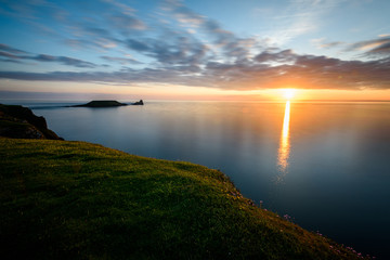Sunset at Rhossili Bay - Rhossili Bay has been voted Wales' Best Beach many times. It is located on...