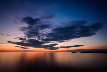 Obraz premium Cloudscape at Rhossili Bay, slow shutter - Rhossili Bay has been voted Wales' Best Beach many times. It is located on the west coast of Gower Peninsular