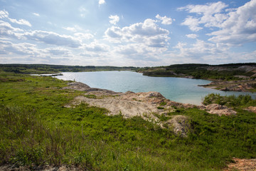 Flooded open pit quarry lake ore clay mining with blue water