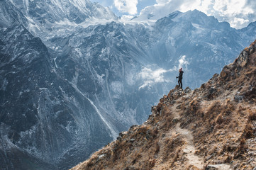 Naklejka na ściany i meble Hiker woman in the mountains Nepal