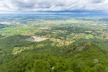 Fototapeta na wymiar Mallorca, Aerial view on green natural spanish fields and forest landscape from above