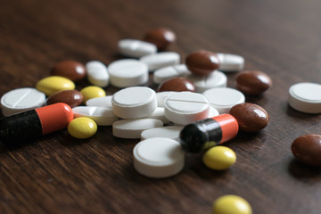 Multicolored tablets. Medical products to maintain good health and well-being.