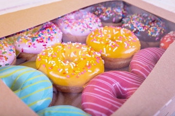 doughnuts studio shot at an angle in a cardboard box